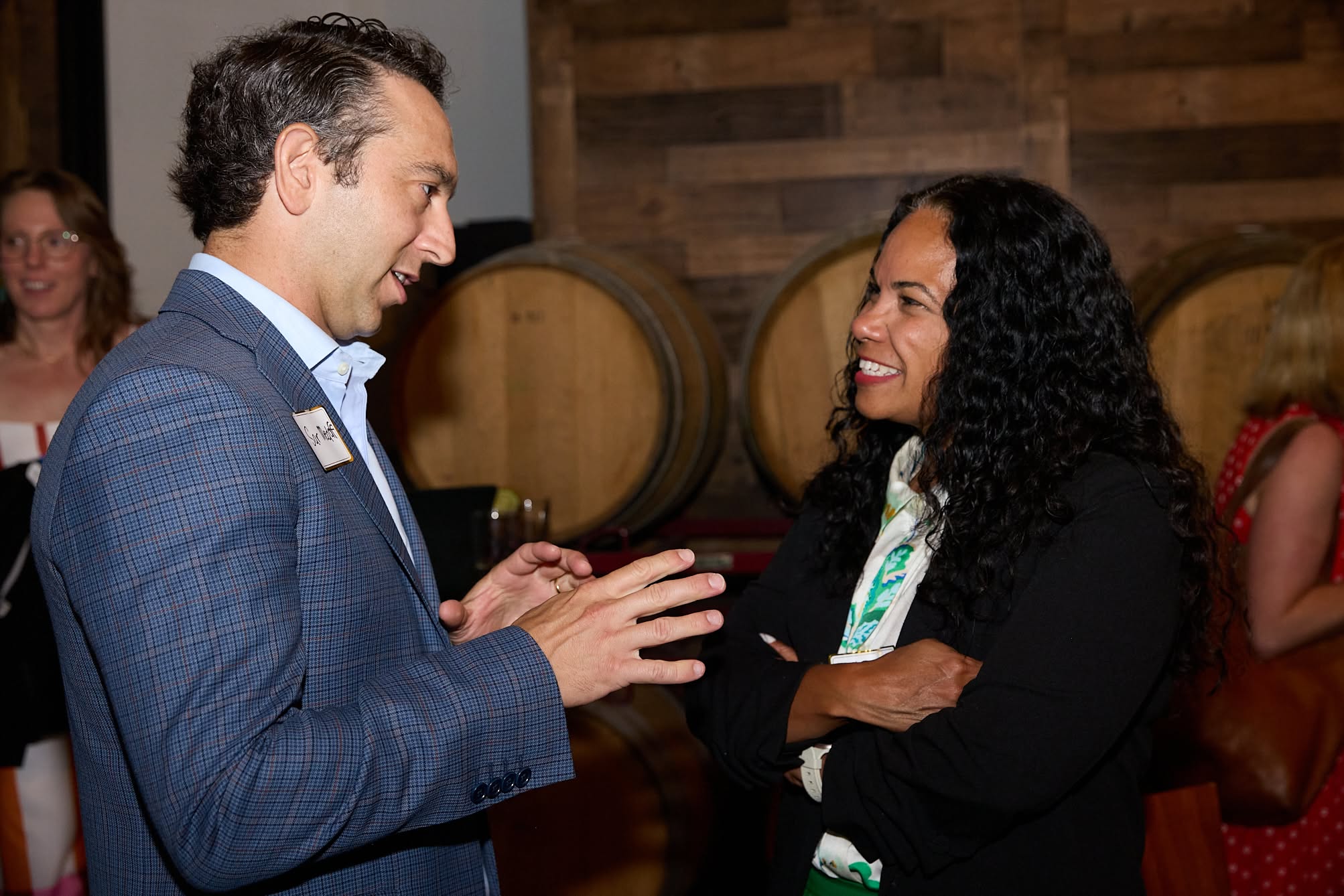 Two attendees chat during the celebration.