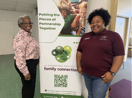 GHF staff with a Crawford County Family Connection partnership banner